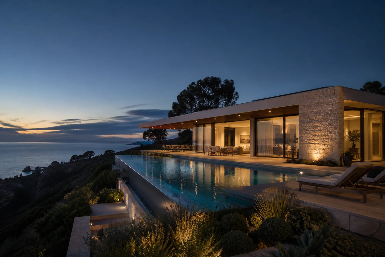 Modern coastal residence overlooking the ocean at dusk